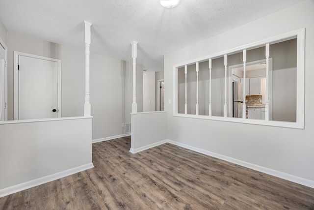 2245 Gennings Ct, Columbus, GA 31907 - unfurnished room with wood finished floors and a textured ceiling