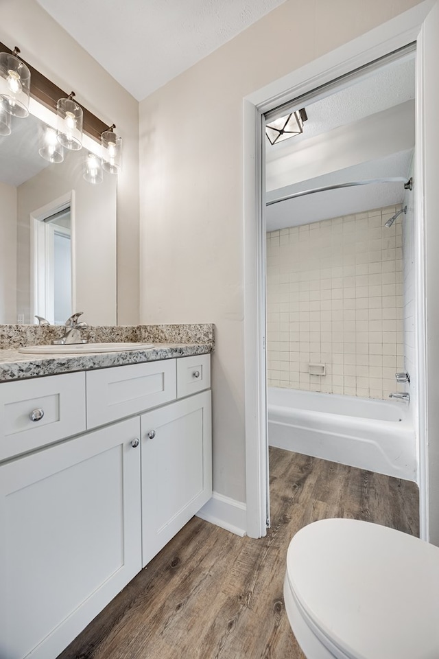 2245 Gennings Ct, Columbus, GA 31907 - bathroom featuring vanity, tub / shower combination, and wood finished floors