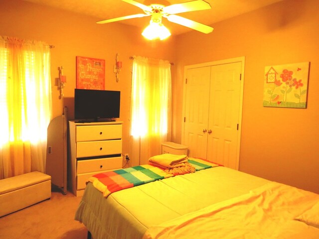 bedroom featuring ceiling fan and visible vents