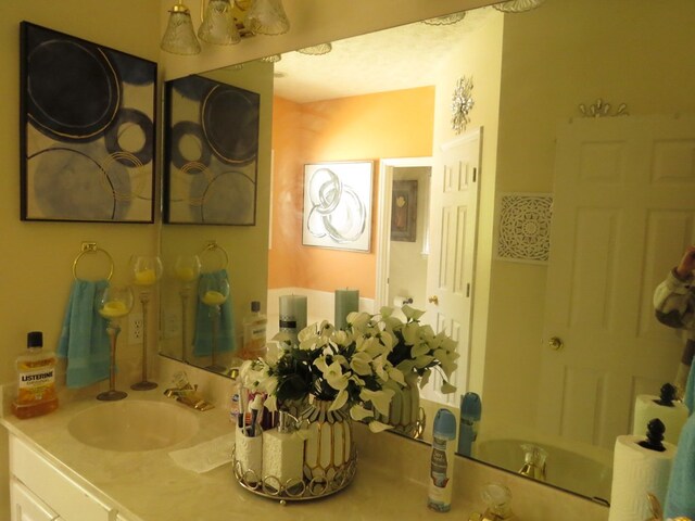 bedroom featuring light colored carpet, ceiling fan, and a closet