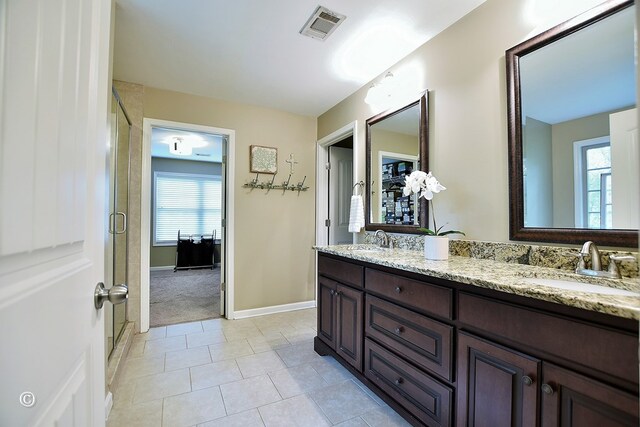 72W Teddy Bear Ln, Waverly Hall, GA 31831 - full bathroom featuring tile patterned floors, a stall shower, double vanity, and baseboards