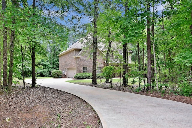 72W Teddy Bear Ln, Waverly Hall, GA 31831 - view of property exterior with brick siding, driveway, and an attached garage