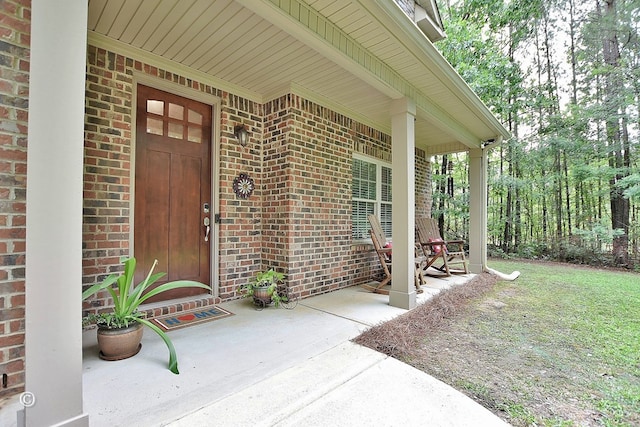 72W Teddy Bear Ln, Waverly Hall, GA 31831 - doorway to property with brick siding and covered porch