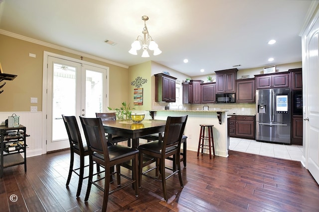 72W Teddy Bear Ln, Waverly Hall, GA 31831 - dining space featuring light wood-type flooring, a chandelier, french doors, and crown molding