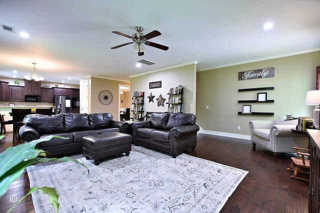 72W Teddy Bear Ln, Waverly Hall, GA 31831 - living room featuring dark wood-style flooring, ceiling fan, ornamental molding, a chandelier, and baseboards
