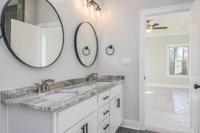 bathroom featuring ornamental molding, vanity, and ceiling fan