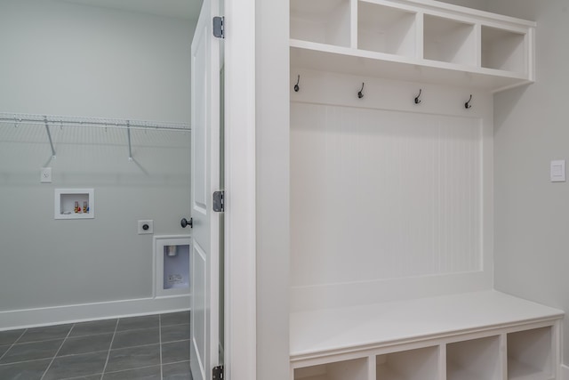 mudroom featuring dark tile patterned floors