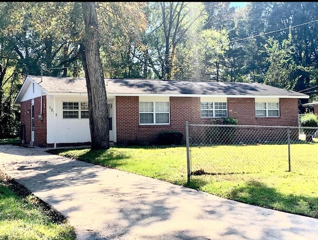 ranch-style home with a front lawn