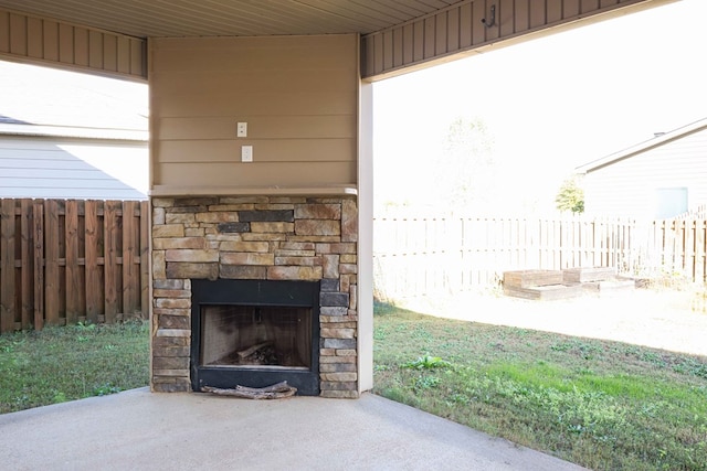 view of patio with an outdoor stone fireplace