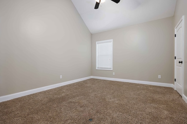 carpeted empty room with ceiling fan and lofted ceiling