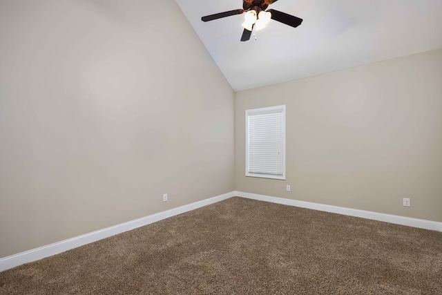 carpeted spare room featuring ceiling fan and vaulted ceiling