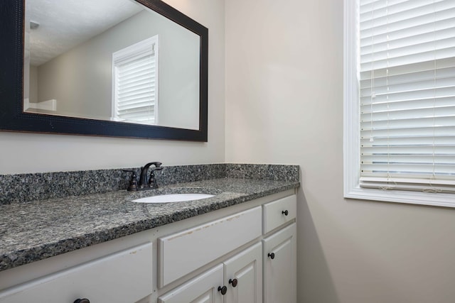 bathroom featuring vanity and a textured ceiling