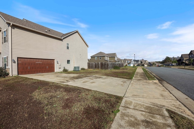 view of property exterior with a garage