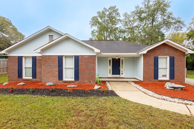 single story home with a front lawn