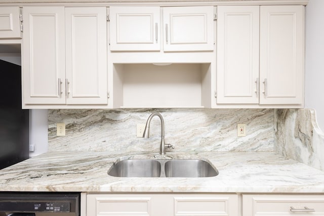 kitchen with white cabinetry, sink, and dishwasher