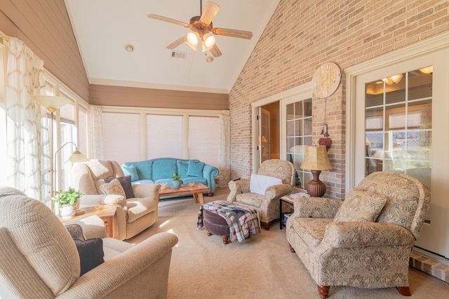 sunroom / solarium featuring vaulted ceiling, visible vents, and a ceiling fan