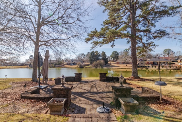 view of patio with a water view