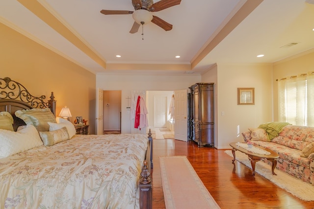 bedroom with baseboards, ornamental molding, wood finished floors, and recessed lighting