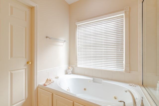 bathroom with a whirlpool tub