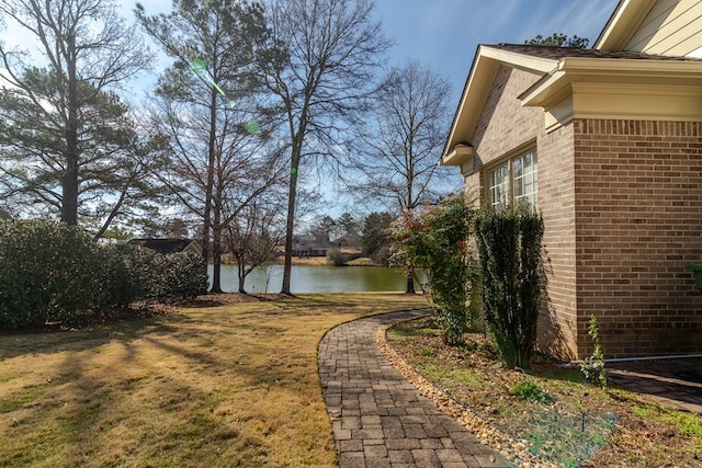 view of yard with a water view