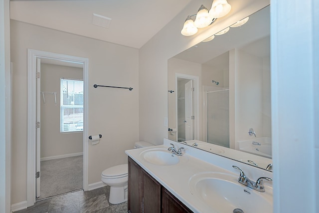 full bathroom with vanity, toilet, and separate shower and tub