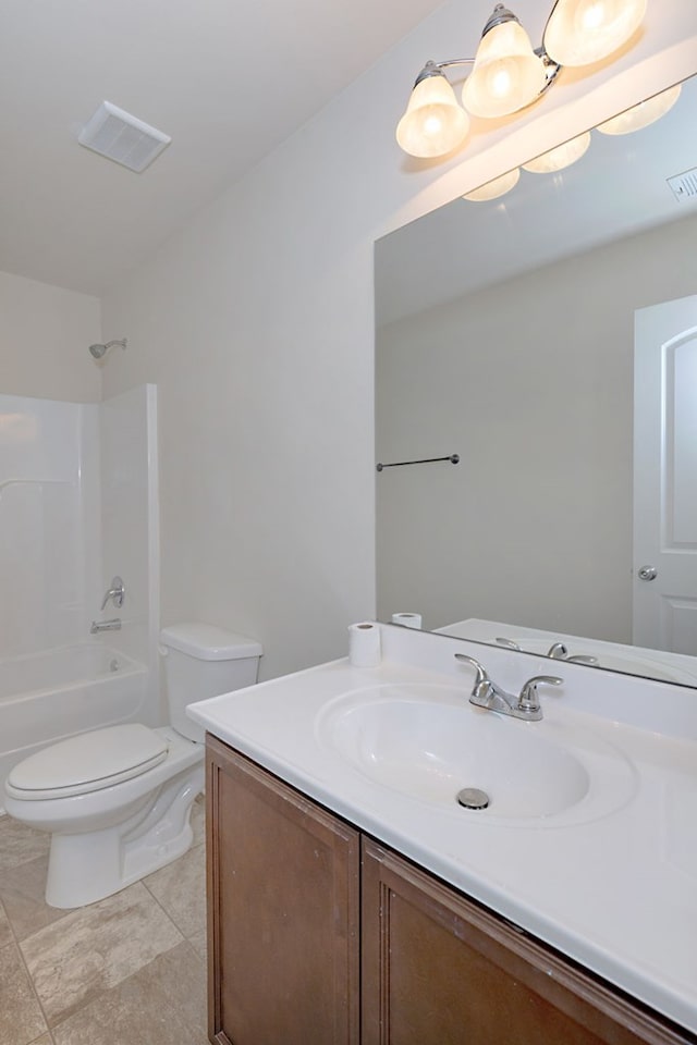 full bathroom featuring vanity, bathtub / shower combination, and toilet