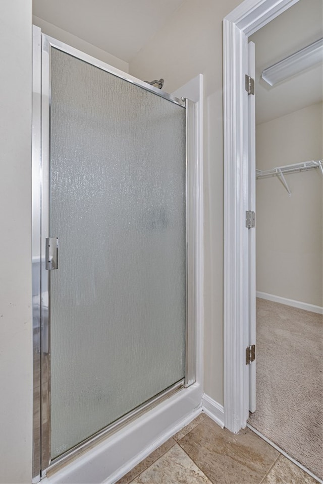 bathroom featuring an enclosed shower