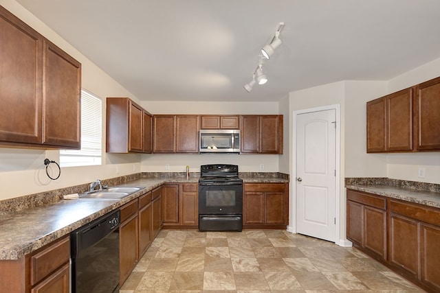 kitchen with track lighting, sink, and black appliances