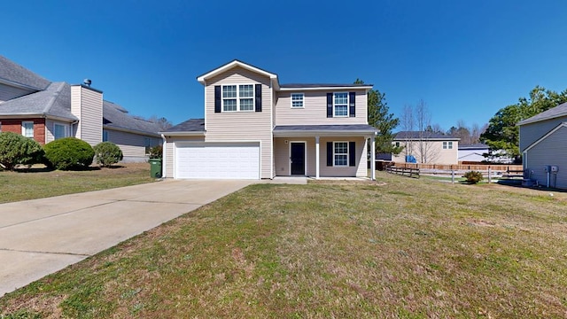 traditional home with an attached garage, concrete driveway, a front lawn, and fence