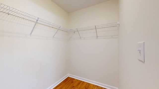 spacious closet with wood finished floors