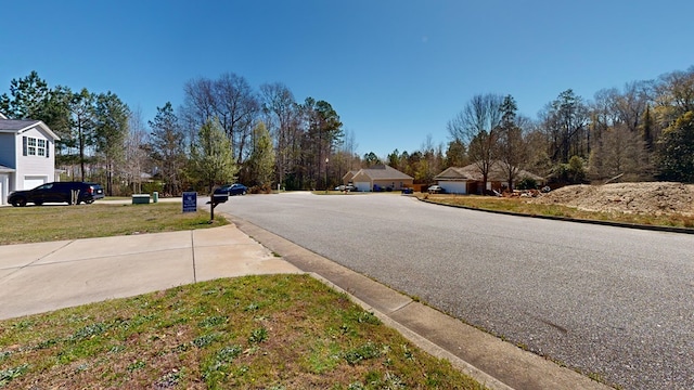 view of road featuring curbs