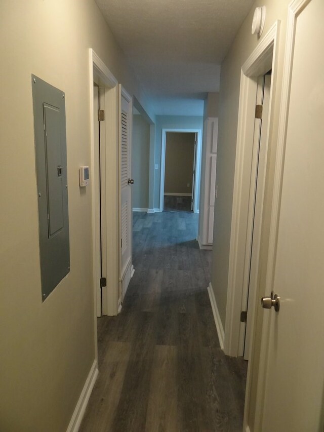 5808 Fairchild Dr, Columbus, GA 31909 - hallway featuring electric panel, dark wood-type flooring, and baseboards