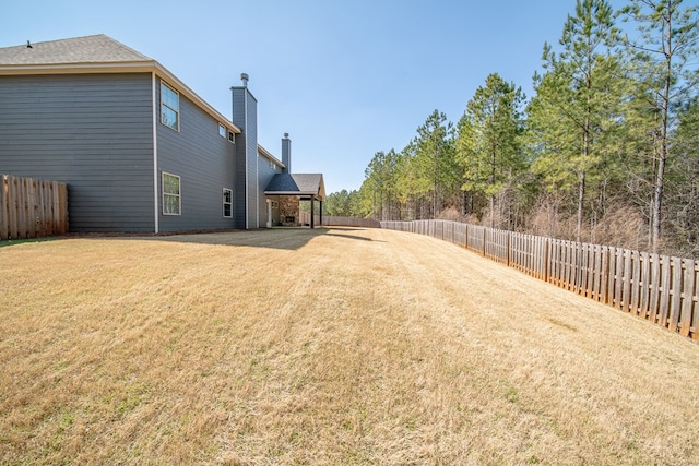 view of yard featuring a fenced backyard