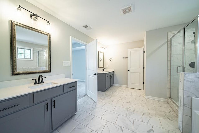 full bath featuring marble finish floor, a shower stall, visible vents, and a sink