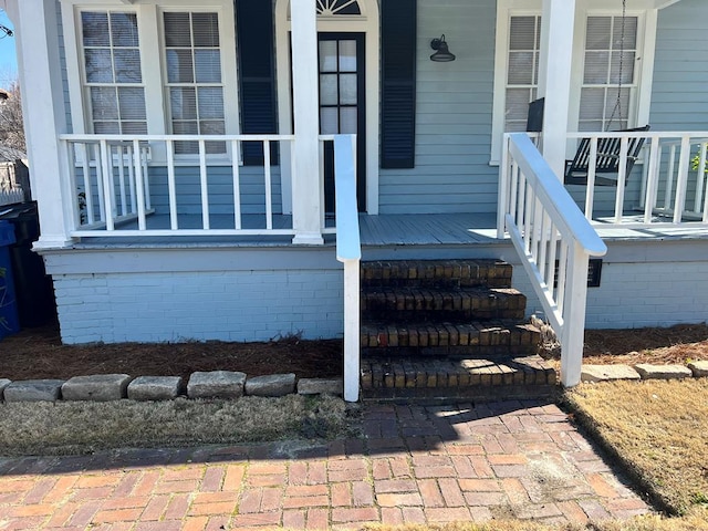 property entrance with covered porch