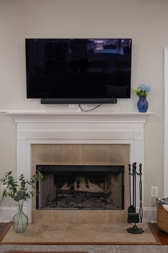 details with a tiled fireplace