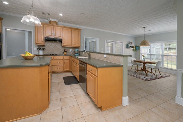kitchen with dark countertops, decorative backsplash, stainless steel dishwasher, and visible vents