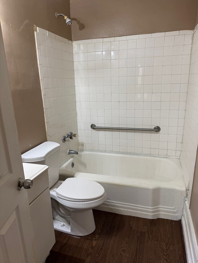 2109 12th Ave, Columbus, GA 31901 - bathroom featuring vanity, washtub / shower combination, wood finished floors, and toilet