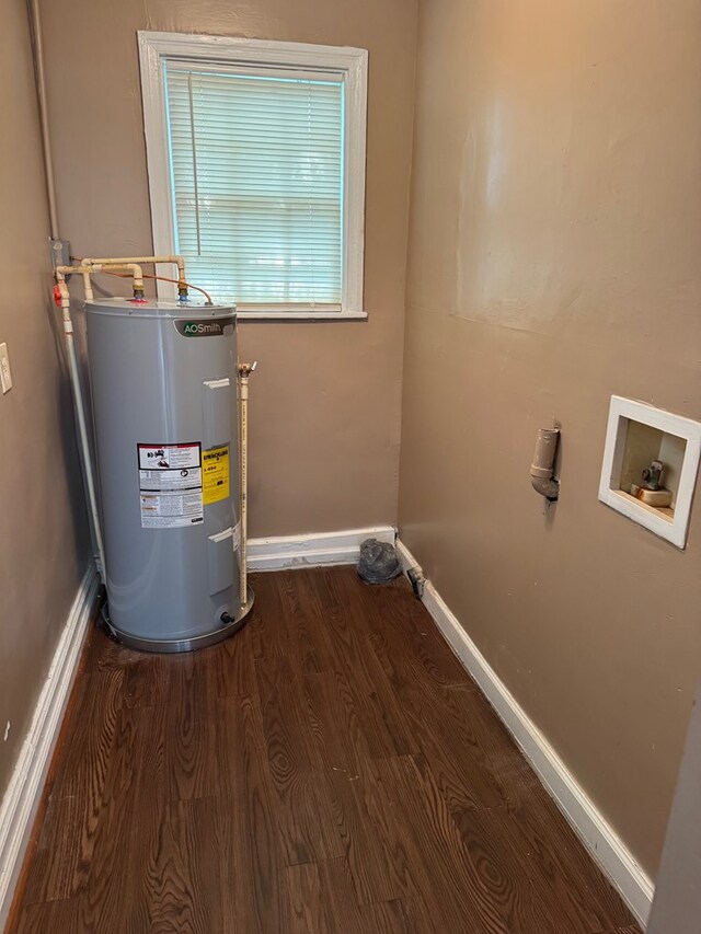2109 12th Ave, Columbus, GA 31901 - laundry room with laundry area, wood finished floors, baseboards, hookup for a washing machine, and water heater