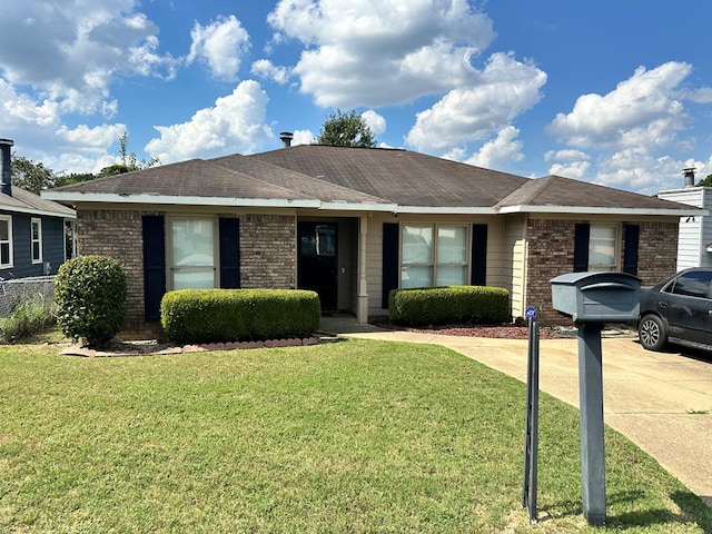 single story home with a front yard