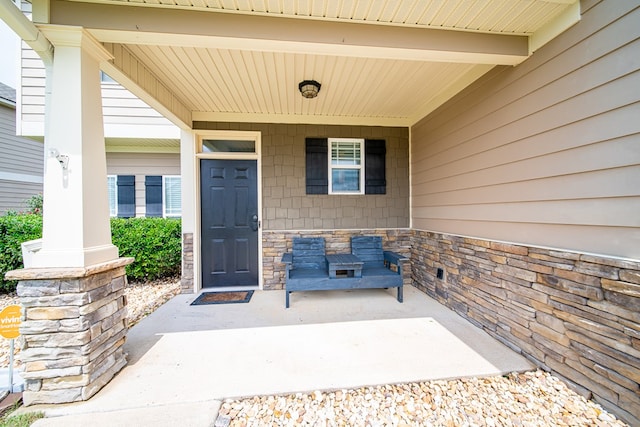 9597 Yarbrough Rd, Midland, GA 31820 - view of exterior entry with covered porch and stone siding