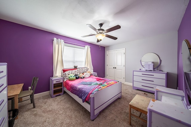 9597 Yarbrough Rd, Midland, GA 31820 - carpeted bedroom featuring a closet, a ceiling fan, and baseboards