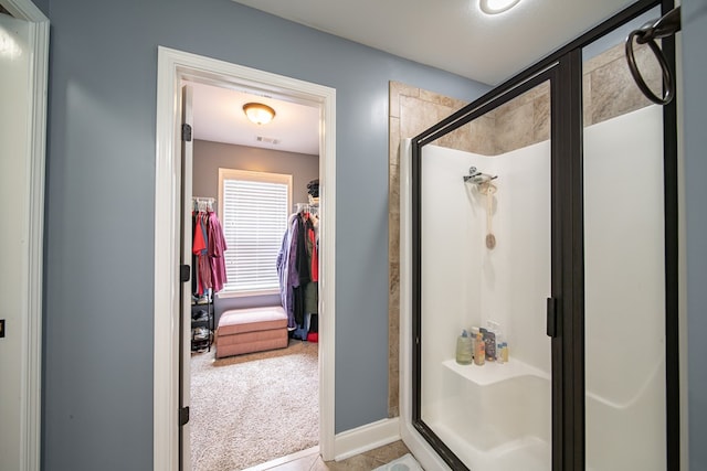 9597 Yarbrough Rd, Midland, GA 31820 - full bath with a stall shower, a walk in closet, and baseboards