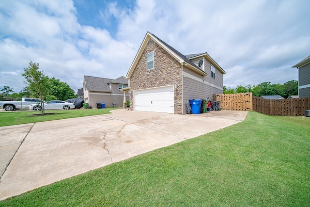 9597 Yarbrough Rd, Midland, GA 31820 - view of side of property with stone siding, a garage, and driveway