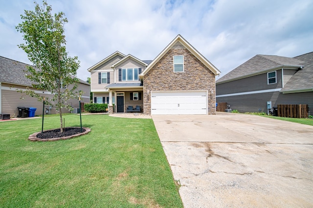 9597 Yarbrough Rd, Midland, GA 31820 - craftsman house featuring stone siding, an attached garage, concrete driveway, and a front yard