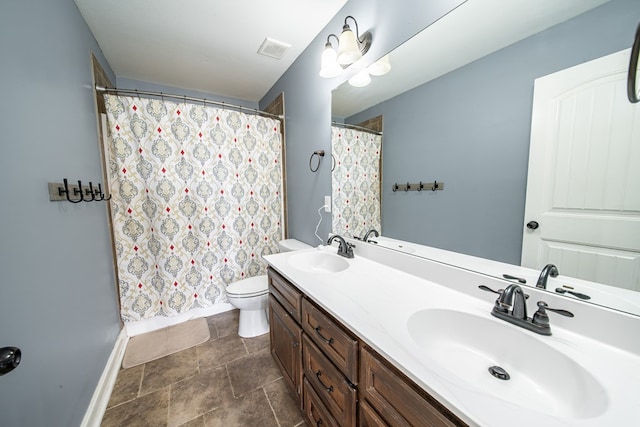 9597 Yarbrough Rd, Midland, GA 31820 - bathroom with baseboards, double vanity, toilet, stone finish floors, and a shower with shower curtain