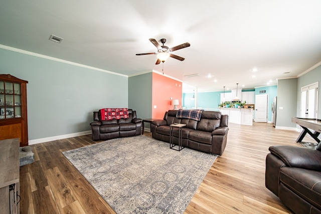 9597 Yarbrough Rd, Midland, GA 31820 - living room with crown molding, ceiling fan, light wood-type flooring, baseboards, and recessed lighting