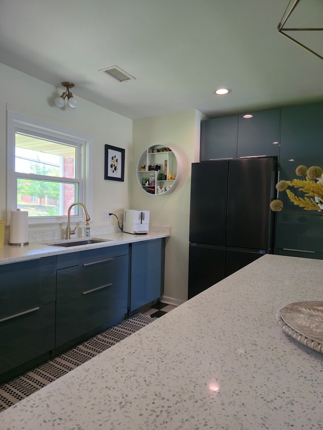 2914 Sue Mack Dr, Columbus, GA 31906 - kitchen featuring freestanding refrigerator, recessed lighting, and light stone counters