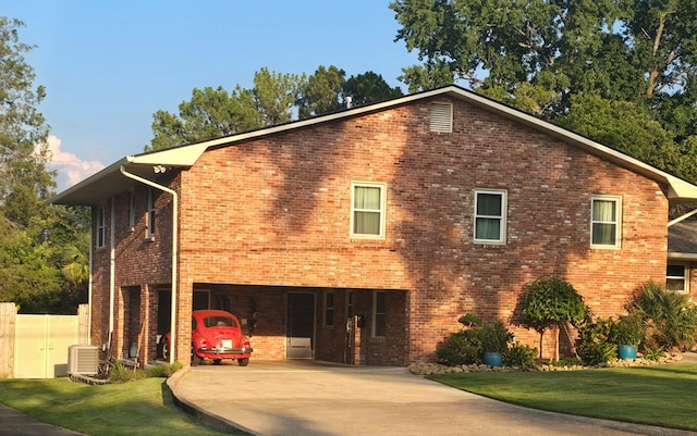 2914 Sue Mack Dr, Columbus, GA 31906 - view of home's exterior with a lawn, brick siding, a carport, and driveway