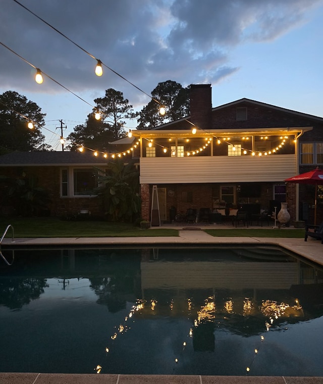 2914 Sue Mack Dr, Columbus, GA 31906 - back of house featuring a balcony, a patio, a chimney, and an outdoor pool